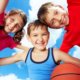 Kids smiling together and playing basketball